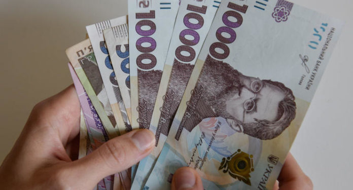 In this photo illustration 1000 hryvnia banknotes seen